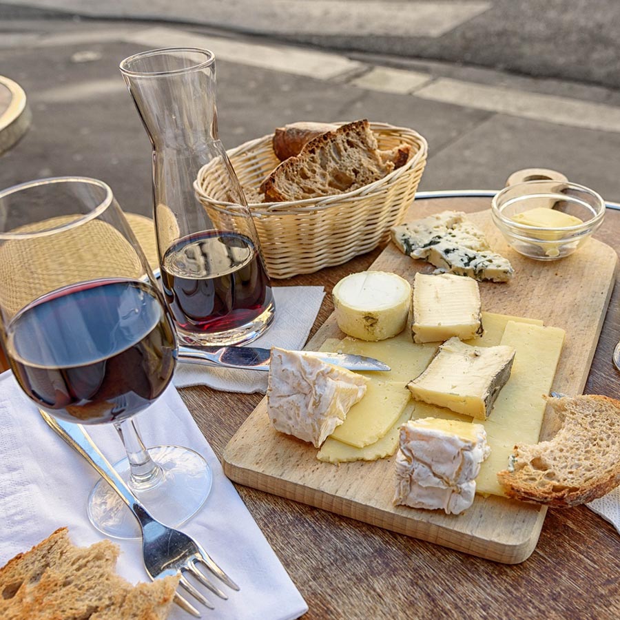 red wine glasses with a cheese board - wine and cheese pairing tour Rome