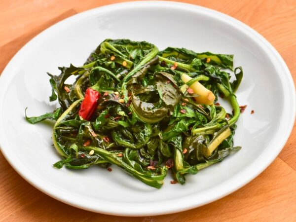 white plate with Cicoria Ripassata on it