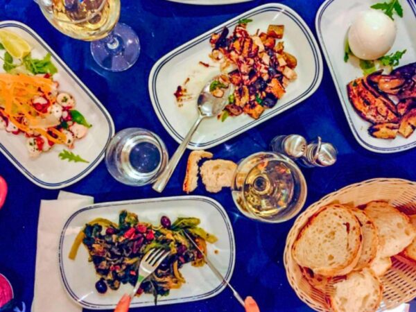 top down view of table with multiple italian side dishes on it