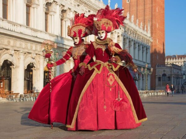 people dressed up in historical costumes in st mark's square venice