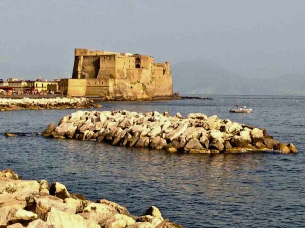 view of castel dell'ovo naples across the bay of Naples