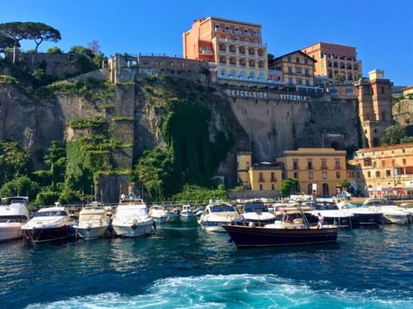 campania italy sorrento marina with small boats and cliffs behind