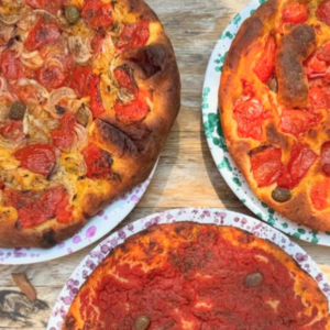 3 pizzas on plates
