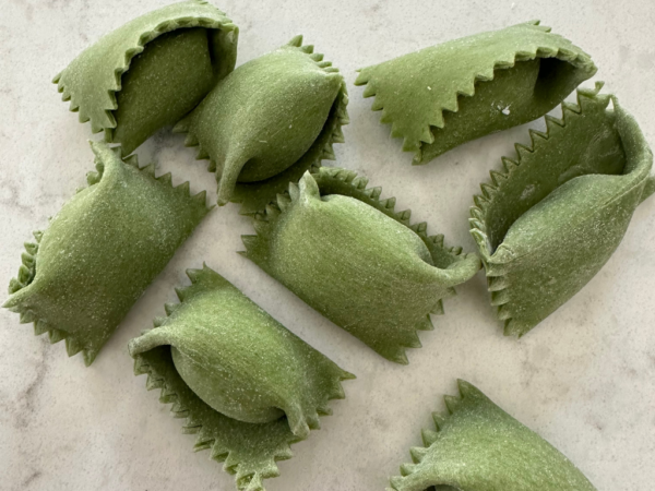 close up of raw agnolotti del plin pieces