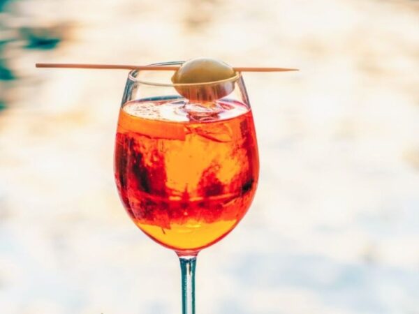select spritz in a glass with olive garnish