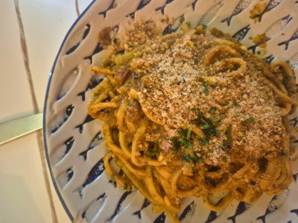 pasta alla palermitana on a blue and white plate