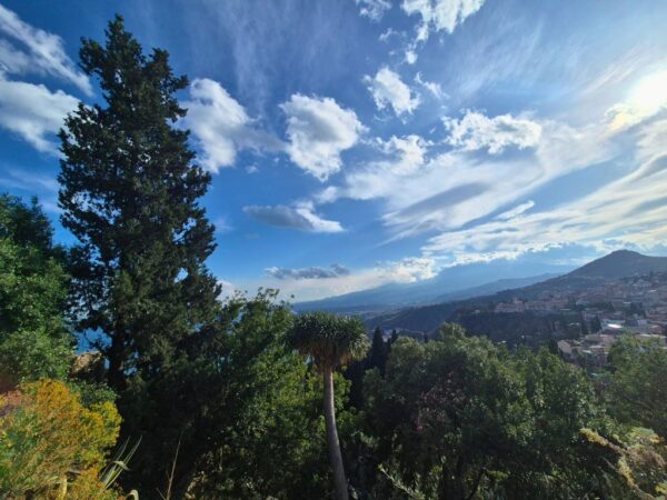 italian spring destinations view of blue skies and countryside from taormina sicily