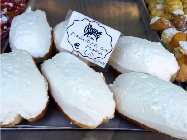 cream filled maritozzi buns on display at Regoli cafe in Rome