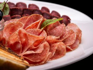 cerspone on a plate of mixed salumi