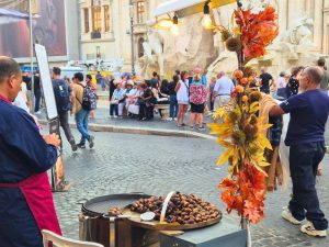 street vendor with roasting chestnuts in piazza navona rome